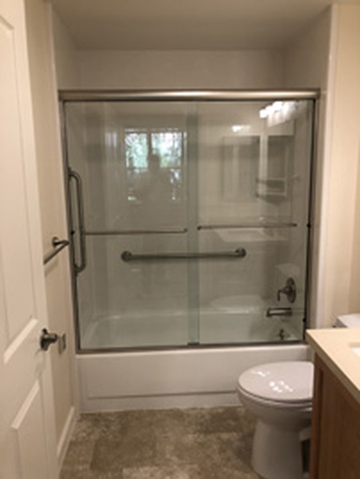 Frameless shower enclosure by Bay Glass & Shower